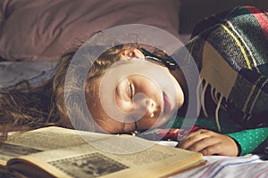 Toned portrait of cute school girl sleeping