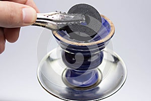 tongs and coal hookah