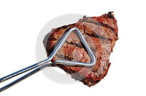 Tongs Holding Grilled Beef Loin Top Sirloin Steak photo