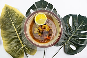 Tongseng kambing traditional food with lemon photo