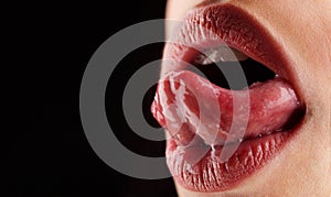 Tongue, lips, mouth. sensual women`s mouth. Healthy teeth and smile, freshness in the mouth. Tongue lick. Female