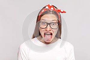 Tongue out of surprised, or shocked crazy emotional young woman