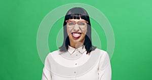 Tongue out, wink and woman face on green screen studio for silly, goofy and nerd expression on mockup background. Space