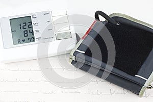 Tonometer on a sheet of EKG