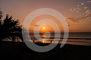 Sunset at the beach of Tonsupa photo