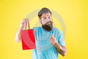 Too expensive. mature male beard with fashion purchase. sad hipster hold paperbag. Man with gift package. Buy product