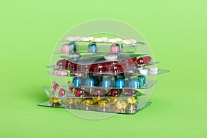 too many different pill cartridges stacked. selective Focus. Packs of blister pills with tablets. Colored pastilles