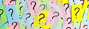 Too Many Questions. Pile of colorful paper notes with question marks. Closeup