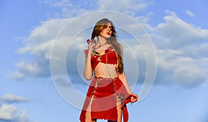 Too sexy for her clothes. hot summer weather. wild and dangerous. beautiful hairstyle. sensual amazon woman sky