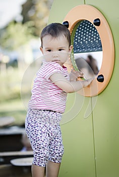 Toodler playing in the park