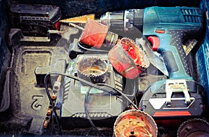 A Tool Box with Drills, Screwdriver and Gears.