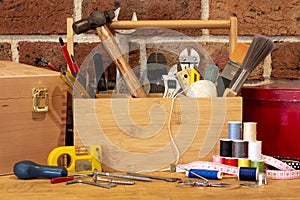 Tool box surrounded by repair tools on bench in cafe used as a community repair centre