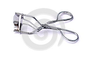Tool for curling eyelashes on a white background. Close-up