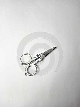 A tool for cutting something, namely scissors