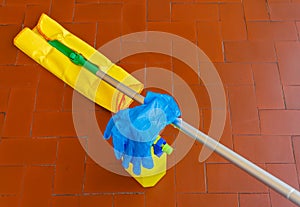 A tool for dusting the floors and the cleaner with the gloves to