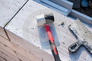 Tool for laying aerated concrete blocks, notched trowel, rubber mallet. Construction of aerated concrete blocks, bricks.