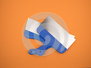 The tool of the painter and plasterer. Orange background
