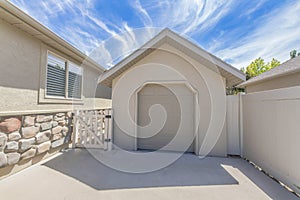 Tool shed with clipped edge entrance and sectional door