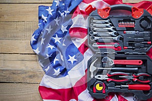 Toolbox with American flag on the wooden table