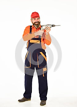 Toolbox tips drilling and fixing. Man in cap with drills white background. Professional builder repairman makes hole