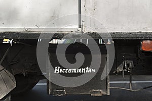 Toolbox under chassis of truck photo