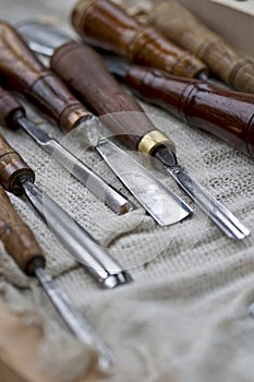 Different carving tools on a craftsman table