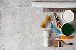 Tools and accessories for repairing rooms, apartments and houses on a concrete background.
