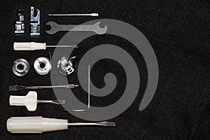 Tools and accessories for sewing on a background of linen fabric