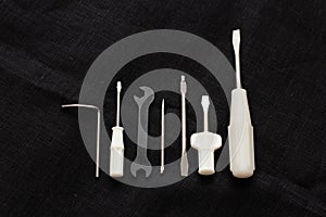 Tools and accessories for sewing on a background of linen fabric