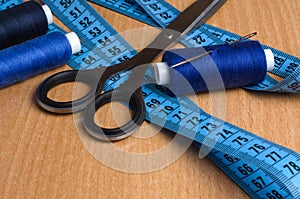 Tools and accessories for sewing. Sewing thread, scissors, tailo