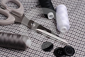 Tools and accessories for sewing. Sewing thread, scissors, butto