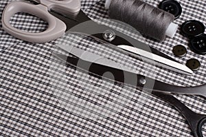 Tools and accessories for sewing. Sewing thread, scissors, butto