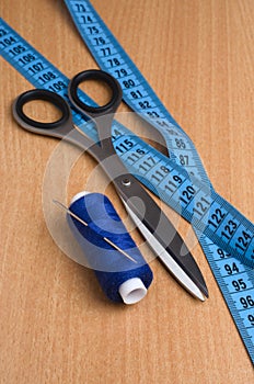 Tools and accessories for sewing. Sewing thread, scissors, tailo