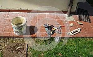 Work tools leaning on the pavement ready to be used