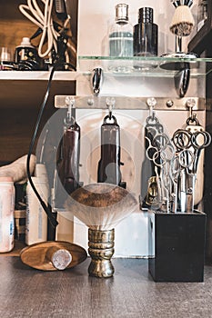 Tools of a barber - Clippers, brushes, baby powder, shears and scissors of various lengths, soothing gels and more
