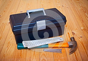 Tools box, hammer, nails and folding ruler
