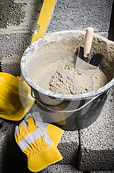 Tools for bricklayer bucket with a solution and a trowel