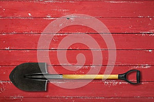 Tools Building and repair - Shovel with a handle red background