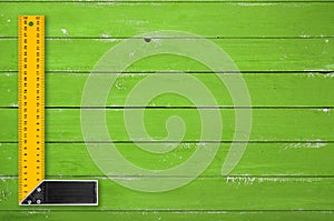 Tools Building and repair - Top view Try square green wooden background