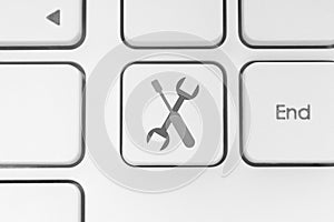 Tools button on white keyboard