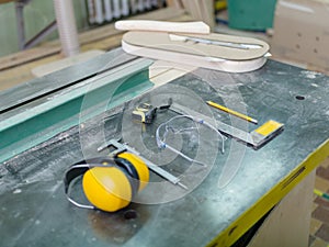 Tools carpenter close-up on a gray background table
