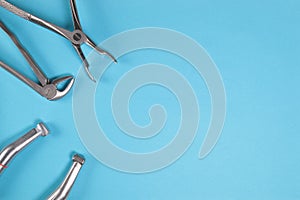 Tools for dentists for dental treatment on a blue background.