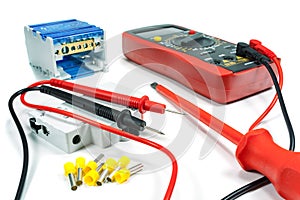 Tools and equipment for electrical work on a white background