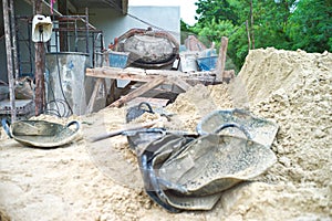 Tools and equipments for construction with the pile of sand