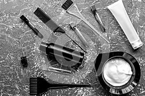 Tools for hair dye in barbershop on gray background top view