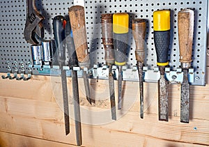 Tools hanging on a board of metal