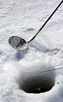 Tools of Ice Fishing - focus on dipper