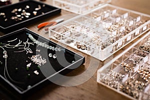 Tools for jewelry making, colorful stone beads. Jewellry workplace. photo