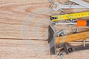 Tools kit border on wooden planks