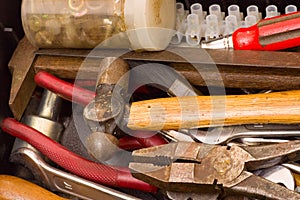 Tools in a messy toolbox